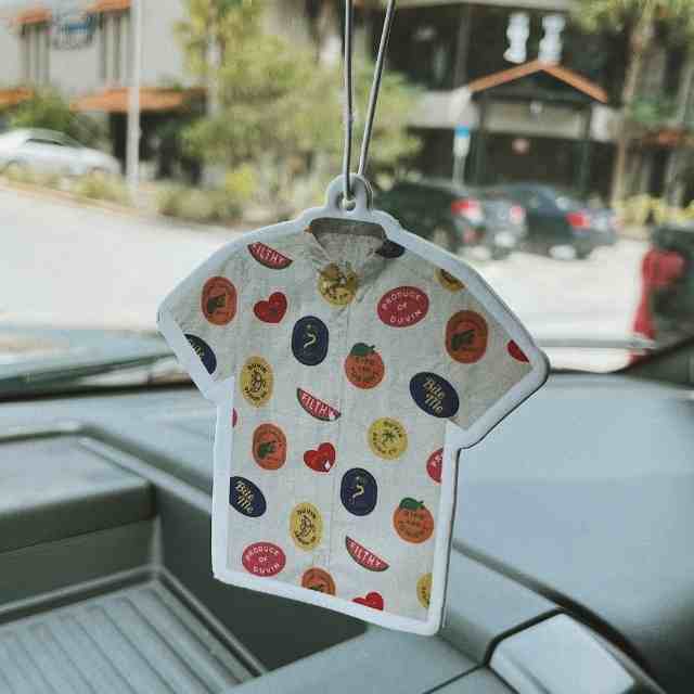 Tiny Duvin Shirt Car Freshener hanging from rearview mirror