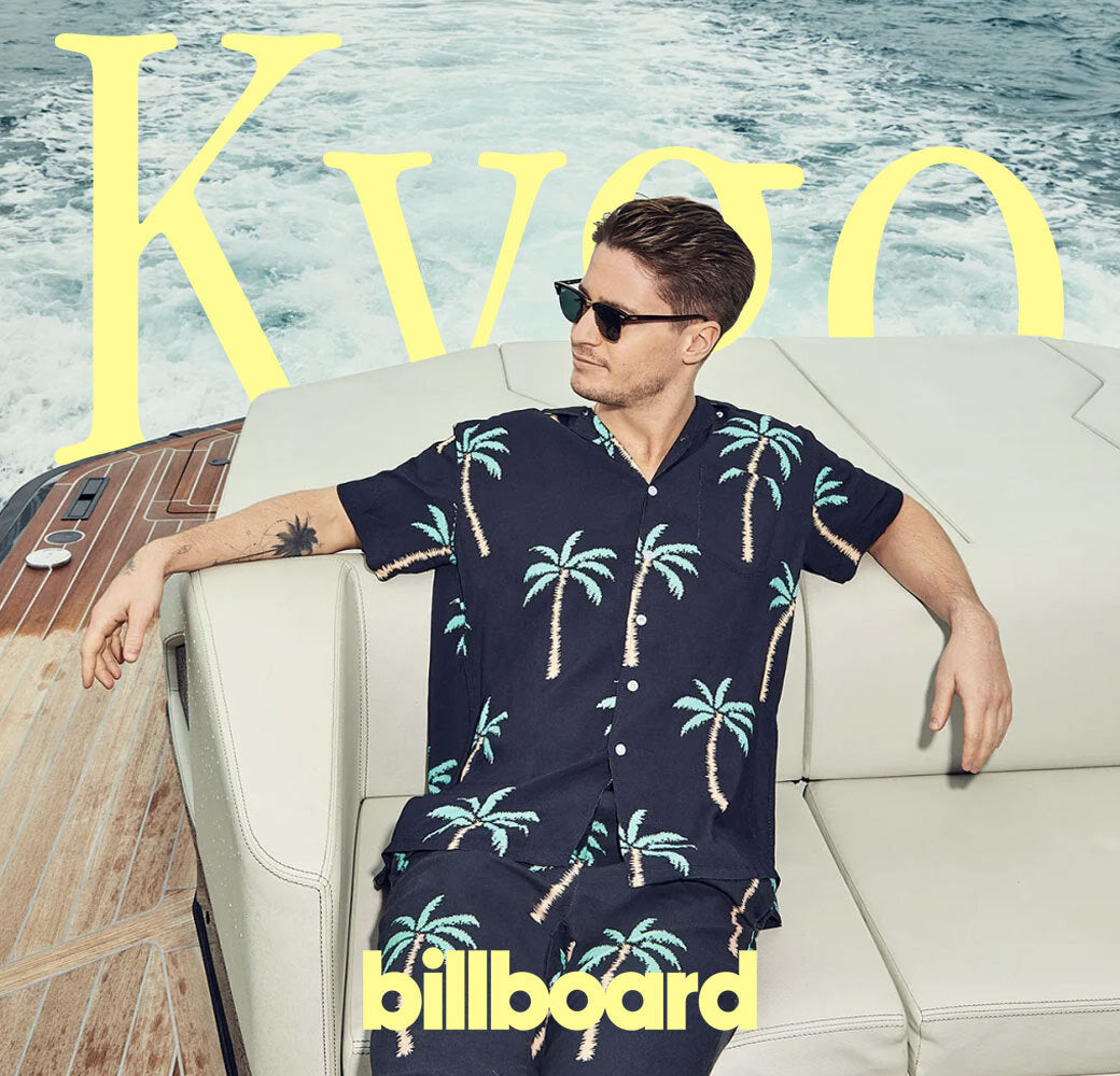 kygo black palm tree shirt and pants on boat